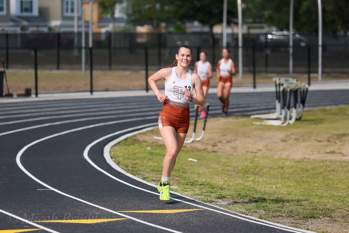 Amelia smiling mid-race on the track at Tocoi Creek